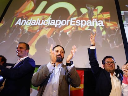 VOX party leader Santiago Abascal (center) and aides celebrate the election results.