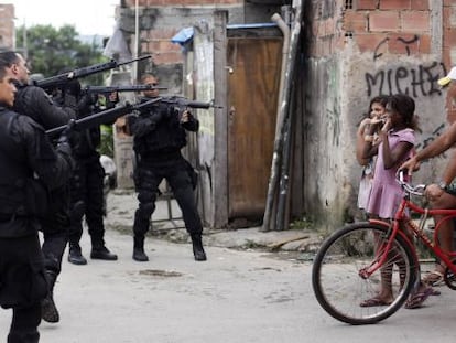 Police enter a poor Rio neighborhood in March 2014.