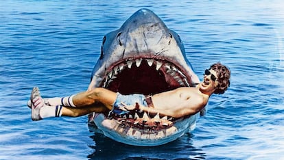 Spielberg poses with one of the shark models from his film.