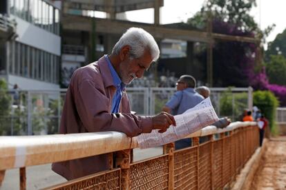 A racegoer looks at his betting sheet during a horse race at Beirut Hippodrome, Lebanon, May 14, 2017. REUTERS/Jamal Saidi  SEARCH "SAIDI HIPPODROME" FOR THIS STORY. SEARCH "WIDER IMAGE" FOR ALL STORIES.
