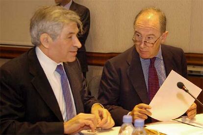 El presidente del Banco Mundial, Paul Wolfowitz, con el director del Fondo Monetario Internacional, Rodrigo Rato.