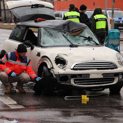 Police takes pictures of a car after some 28 people were hurt when a car driven by an Afghan asylum seeker plowed into a crowd in Munich, Germany, February 13, 2025.    REUTERS/Wolfgang Rattay