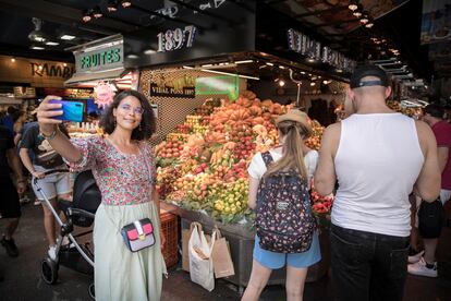 Tourists in Boqueria market in Barcelona.