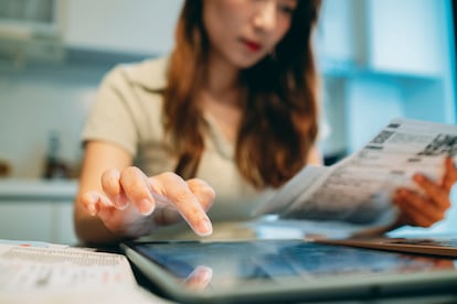 Upset woman thinking about high prices while looking at utilities, gas, electricity, rental charges, Planning personal budget while sitting in kitchen.