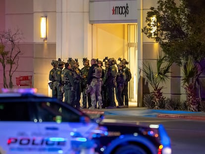 Police officers gather at an entrance of a shopping mall, Wednesday, Feb. 15, 2023, in El Paso, Texas.