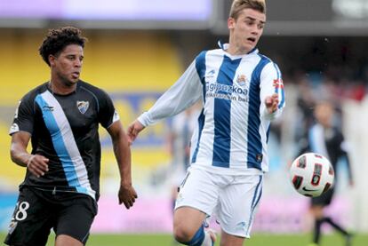 Antoine Griezmann y Eliseu Pereira,  durante el partido