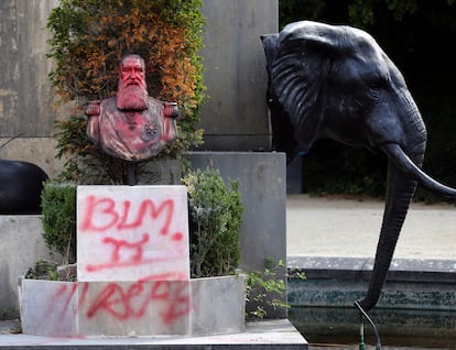 A graffitied statue of King Leopold II, in the gardens of the Royal Museum for Central Africa in Brussels, in 2020.