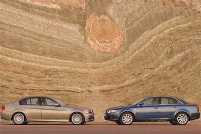 Dos berlinas medias de prestigio con estéticas diferentes. El BMW 320d (izquierda) tiene una línea más estilizada y deportiva. El Audi A4 2.0 TDi (derecha) presenta unas formas más suaves y robustas.