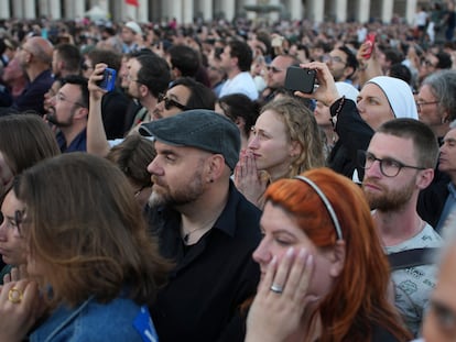 Faithful react as the newly elected Pope Leo XIV appears at the balcony of St. Peter's Basilica at the Vatican, Thursday, May 8, 2025. (AP Photo/Emilio Morenatti)
