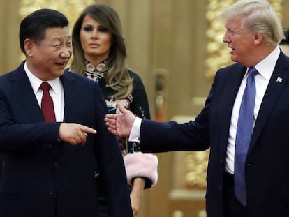 Donald Trump, à direita, ao lado de Xi Jinping, em novembro, em Pequim