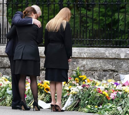 Prince Andrew stands with his daughters, Princesses Eugenie and Beatrice, at a makeshift shrine in memory of Queen Elizabeth II at Balmoral Castle in Scotland.