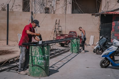 Munir Saleh (in red), at work in Burj Al Barajne last month.