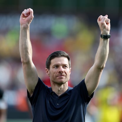 LEVERKUSEN, GERMANY - MAY 11: Xabi Alonso, Head Coach of Bayer 04 Leverkusen, celebrates with fans after the Bundesliga match between Bayer 04 Leverkusen and Borussia Dortmund at BayArena on May 11, 2025 in Leverkusen, Germany. (Photo by Lars Baron/Getty Images)