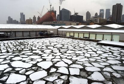 OPSHOTS Snow covered ice is seen on the Hudson River outside of Pier 92 and 94 in New York City on February 17, 2015. AFP PHOTO / TIMOTHY A. CLARY