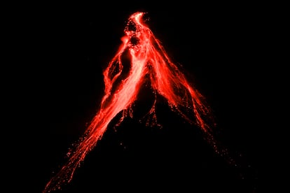 Mayon volcano belches red-hot emissions down it's slope as seen from Legaspi, Albay province, northeastern Philippines, 2023