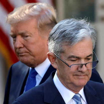 FILE PHOTO: U.S. President Donald Trump looks on as Jerome Powell, his nominee at the time to lead the U.S. Federal Reserve, moves to the podium at the White House in Washington, U.S., November 2, 2017. REUTERS/Carlos Barria//File Photo