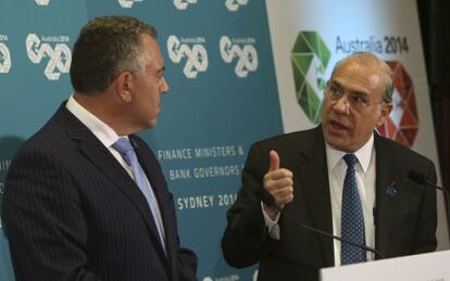 Gurría se dirige al ministro de Finanzas de Australia, Joe Hockey, en una rueda de prensa previa a la reunión del G-20 que se celebra este fin de semana en Sídney.