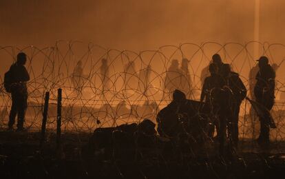 People near gate 42 of the border wall in Ciudad Juárez on May 12.