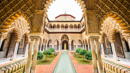 Seville, Spain - November 7, 2014: The Royal Alcazar of Seville at the Courtyard of the Maidens. It is the oldest royal palace still in use in Europe.
