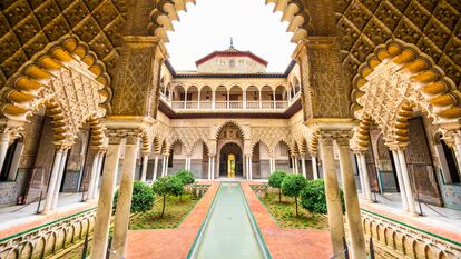 Seville, Spain - November 7, 2014: The Royal Alcazar of Seville at the Courtyard of the Maidens. It is the oldest royal palace still in use in Europe.