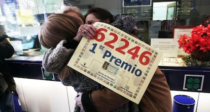 Three women celebrate winning ‘El Gordo’ in Leganés, Madrid in 2013.