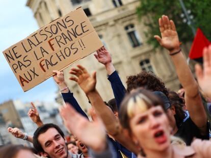 People gather to protest against the French far-right Rassemblement National party, at Place de la Republique following partial results in the first round of the early 2024 legislative elections, in Paris, France, June 30, 2024. The slogan reads "Let's not leave France to the fascists."