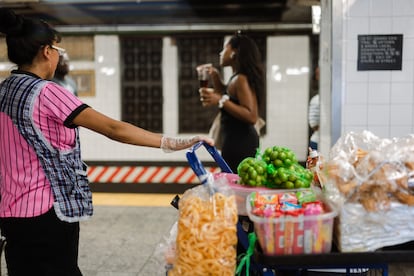 A woman sells fruit on the subway platform at Grand Central Station on Wednesday, June 26, 2024 in New York City.