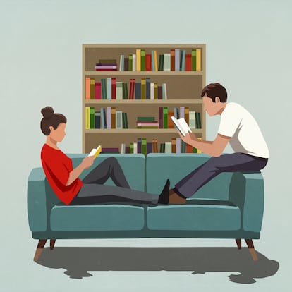 Couple reading books on sofa at home