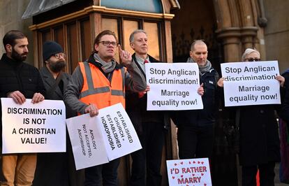 Gay activists protest outside Church House in London, where the Church of England is holding its General Synod.