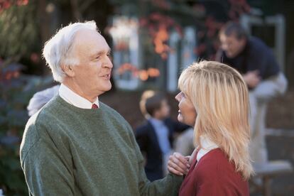 Father talking to adult daughter