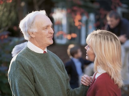 Father talking to adult daughter