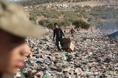 Fires and a landfill next to a forested area in Idlib, in northeastern Syria, in 2020