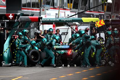 Crew work on the car of Aston Martin driver Fernando Alonso of Spain during the Monaco Formula One race, at the Monaco racetrack, in Monaco, Sunday, May 28, 2023. (Christian Bruna/Pool Photo via AP)