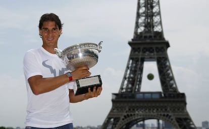 Nadal poses with the Roland Garros trophy in Paris.