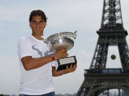 Nadal poses with the Roland Garros trophy in Paris.