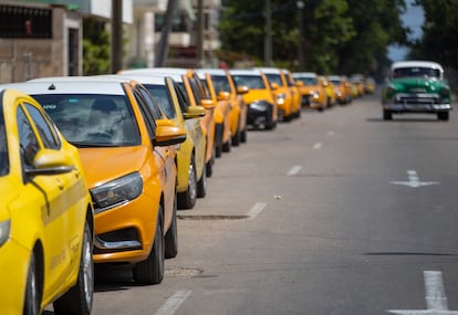 A long line of taxicabs waiting to refuel in Havana during Holy Week.