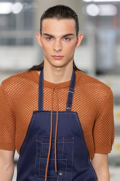 The new collection includes nods to workwear and traditional craftsmanship, like this apron. 