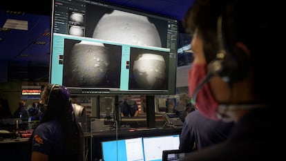 Members of NASA's Perseverance Mars Rover team in mission control as the first images arrive moments after the spacecraft successfully touched down on Mars on February 18, 2021. 