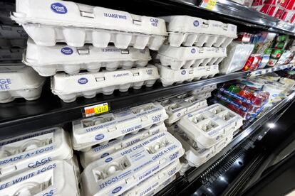 Cartons of fresh eggs line a display case inside a Walmart store in North Reading, Massachusetts, on March 15, 2024.