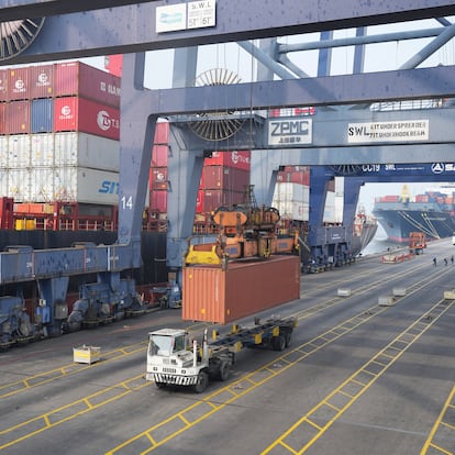Cranes unload a shipping container from a truck at Jakarta International Container Terminal (JICT) at Tanjung Prior Port in Jakarta, Indonesia, Friday, April 11, 2025.(AP Photo/Tatan Syuflana)
