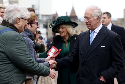 Britain's King Charles III and Queen Camilla greet people after attending the Easter Matins Service at St. George's Chapel, Windsor Castle, England, Sunday, March 31, 2024. 