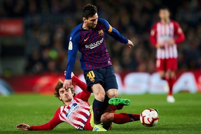 Lionel Messi y  Antoine Griezmann durante el partido.