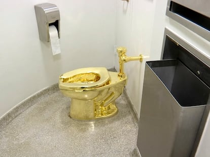 This Sept. 16, 2016 file image made from a video shows the 18-karat toilet, titled "America," by Maurizio Cattelan in the restroom of the Solomon R. Guggenheim Museum in New York.