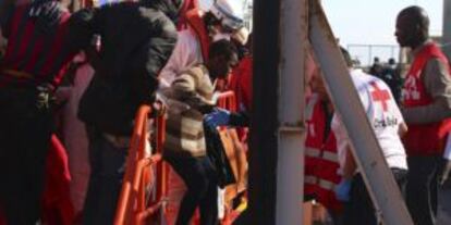 Red Cross workers help newly arrived boat migrants in Almería.