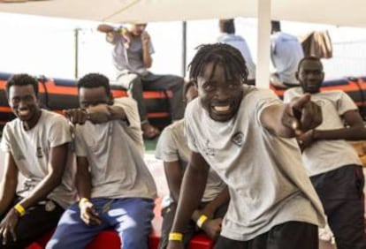 Migrants celebrating aboard the Open Arms ship.