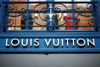 A sign outside a Louis Vuitton luxury boutique operated by LVMH Moet Hennessy Louis SE is pictured in Paris, France, January 25, 2024.