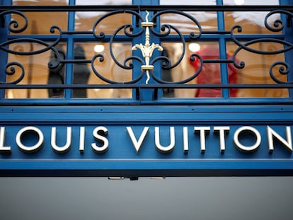 A sign outside a Louis Vuitton luxury boutique operated by LVMH Moet Hennessy Louis SE is pictured in Paris, France, January 25, 2024.