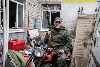 A soldier from the so-called Donetsk People's Republic, an area of Ukraine occupied by Russia, poses on a motorcycle in April 2022.  