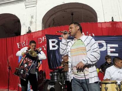 Members of prison rock band formed by 'Vatayón Militante' play at a recent government rally.