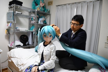 Akihiko Kondo at home in Tokyo with a life-size doll of Hatsune Miku, the virtual pop star he married in 2018